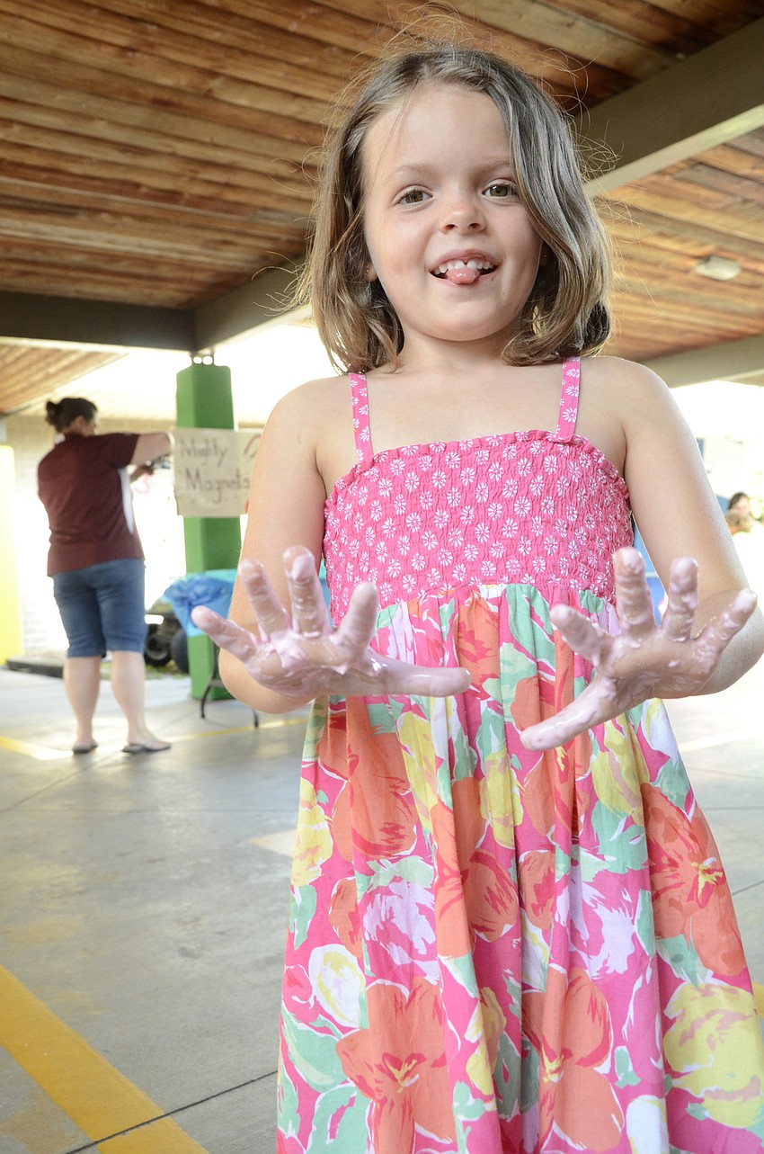Adalynn shows off her slimy hands.
