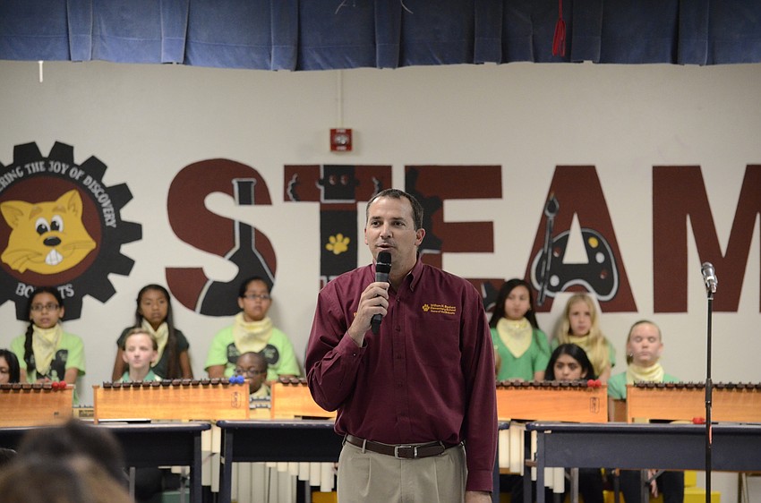Principal Joshua Bennet talks before the fifth-grade performance.