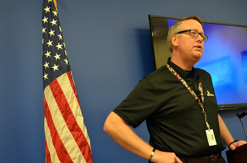 Sarasota County Emergency Services Director addresses reporters at a mock press briefing.
