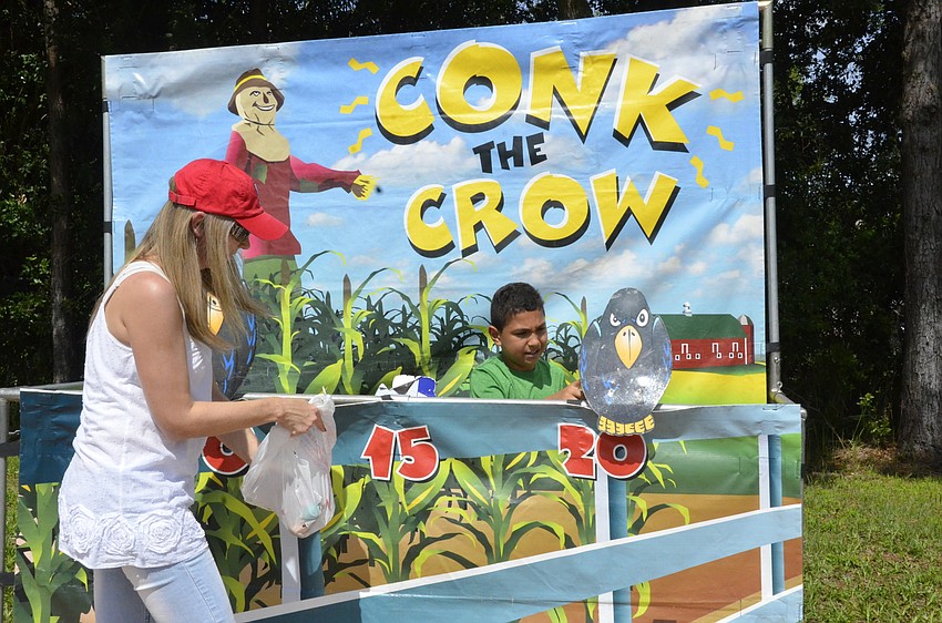 Julia Salambash volunteers with help from Yanal Mansour.