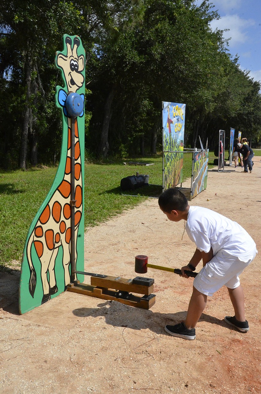 Luis Gusman pounds the bell.