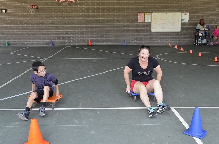 Media specialist Kim Brown challenged Anthony Oliveo to a race.