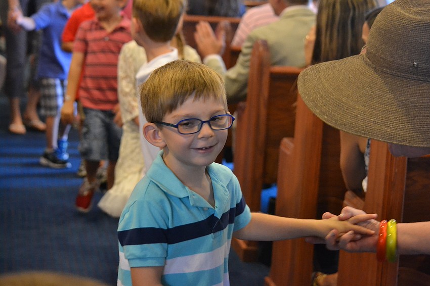Charlie Horn receives congratulations from his grandmother Maureen Horn.
