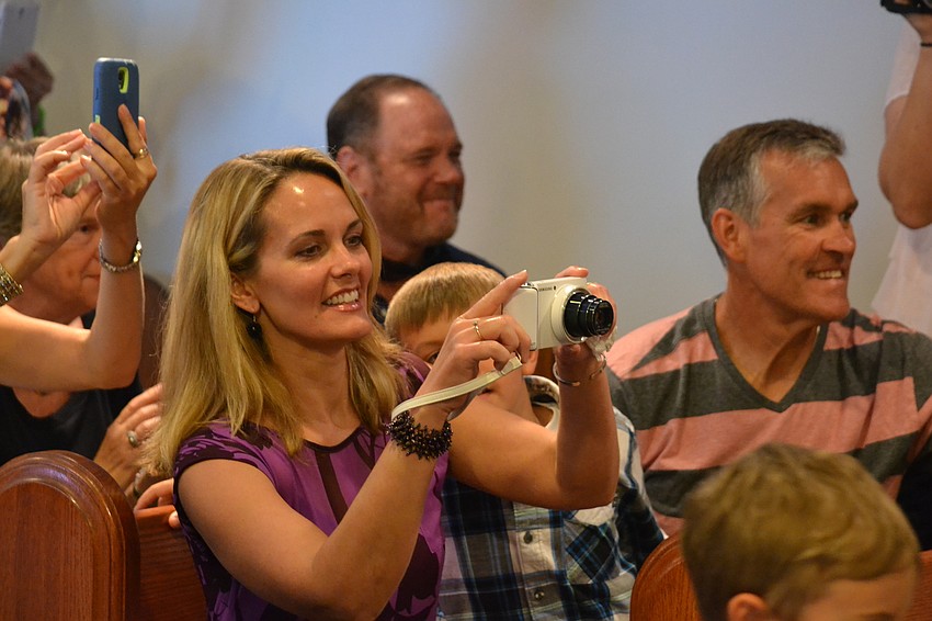 Colleen Joiner snaps photos of Elijah Joiner.