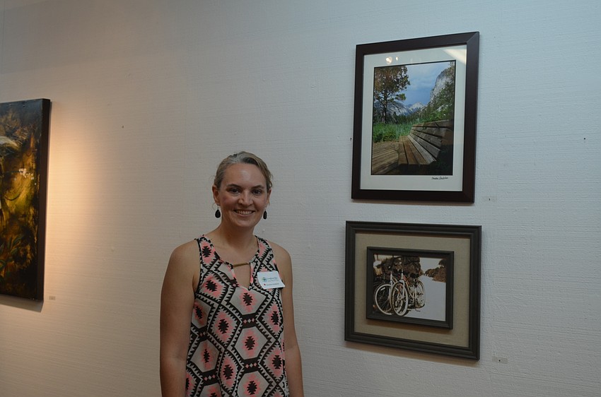 Christine Schebilski, of Heron Creek Middle School, with her art, “To the Canyon” and “V-Town Cruisin’”