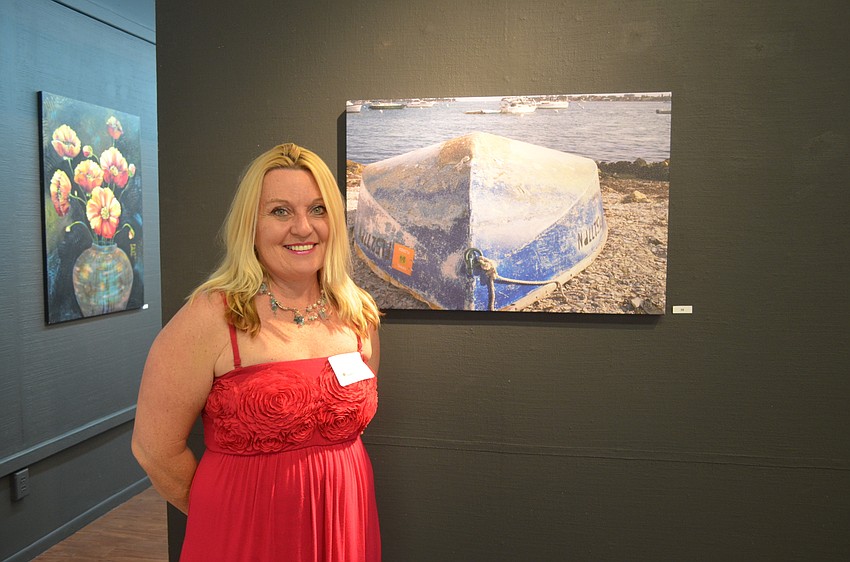 Debbie Gerardi, of Lakeview Elementary School, with her art, “Beached.”