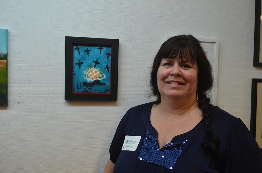 Jackie Henson-Dacey, of Riverview High School, with her art, “Pleasant Dreams.”