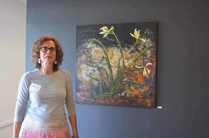 Gail Bruder-Werner, of Venice High School, with her art, “Yellow Iris.”