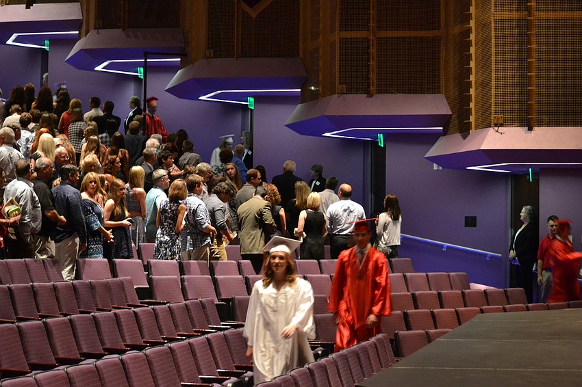 Graduates file into their seats at the Van Wezel Performing Arts Hall.