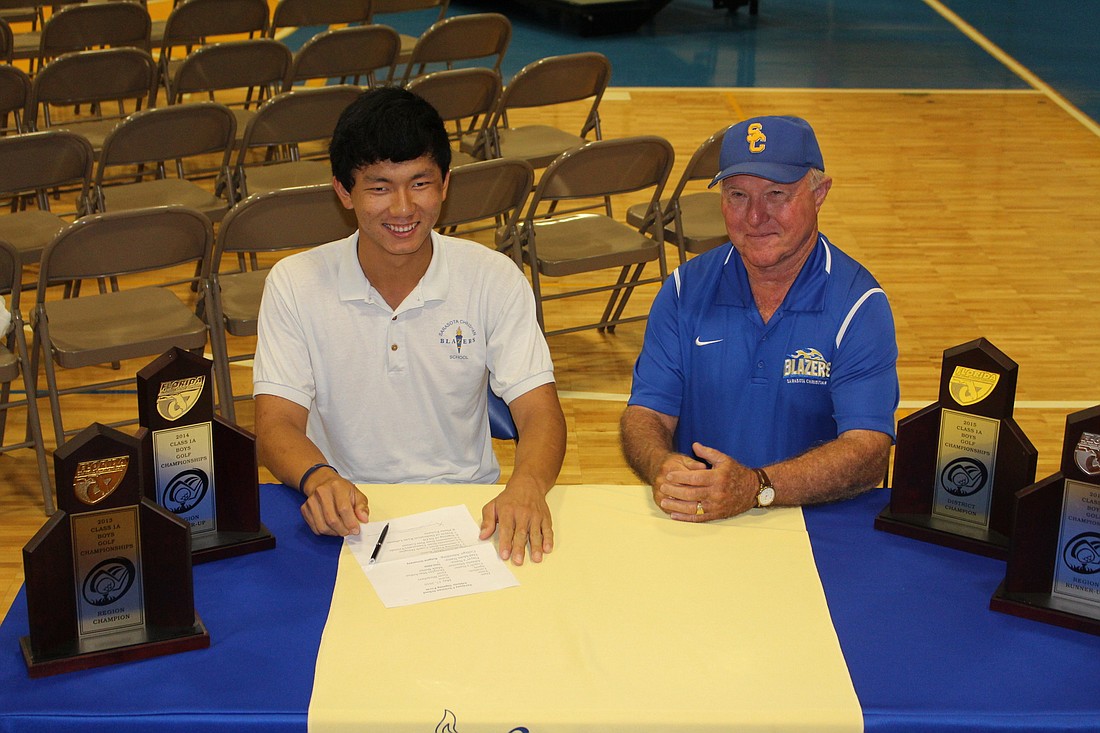 Sarasota Christian senior Tony Jiang, pictured with coach Douglas MacArthur, will play golf for Rutgers University this fall. (courtesy photo)