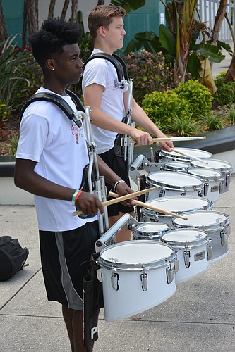 Drummers Ted Robinson, who will be a 10th-grader next semester, and Max Gonzalez, 11th grade, practice for the Tribute to Heroes Parade.