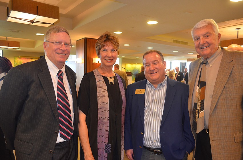 John Hament, Anne Folsom Smith, Vice President of Health Services Joe Devore and Frank Folsom Smith