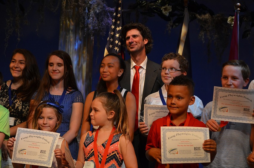 Adam Ratner joins Young Playwrights Festival winners onstage.