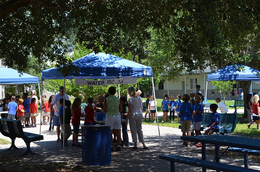 Students rotated between booths for different events in the Measurement Olympics.