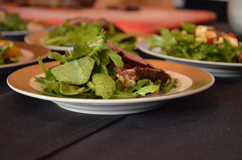 Capital Grille previewed its dry-aged sirloin steak with roasted pepper, mozzarella and arugula salad.