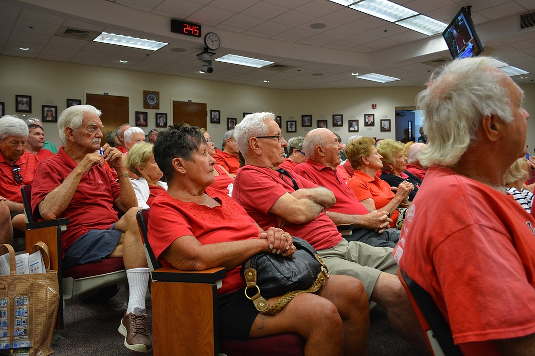 More than 100 residents of Tara, University Place and neighboring communities sported red shirts at the May 24 to show their opposition to the Tara Bridge project.