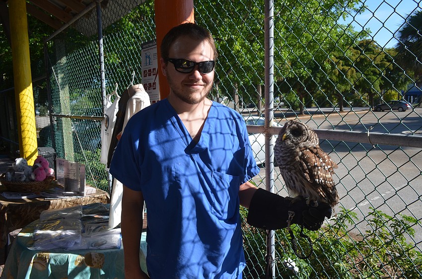 Rehabilitation veterinary technician Jonathan Hande with Nova, a barred owl