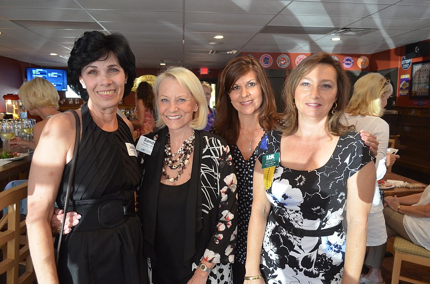 Jeanne Brittain, of Caswell Legal, and Sandra LaRose, Deanna Vanacore and Irina LaRose, of Design 2000