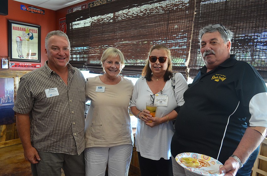Allan Zuckerman, of Beach Breeze Weddings, Chamber President Gail Loefgren and CJ and Joe Bader, of Siesta Trolley