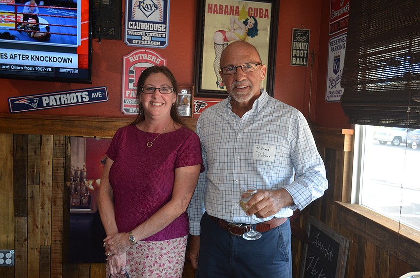 Charlotte Dakel, of Fidelity Bank, and Richard Perlman, of Michael Saunders & Co.