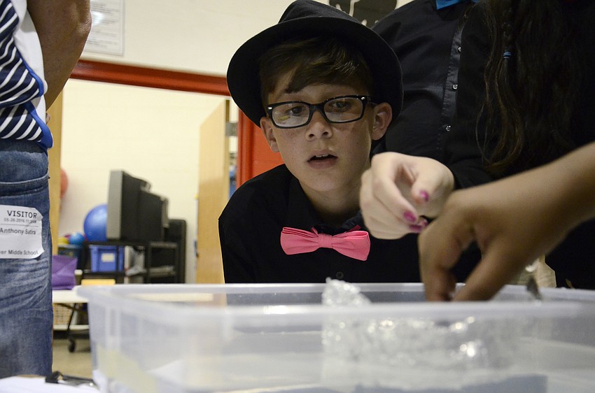 Devin Vancil carefully monitors his team's foil boat.