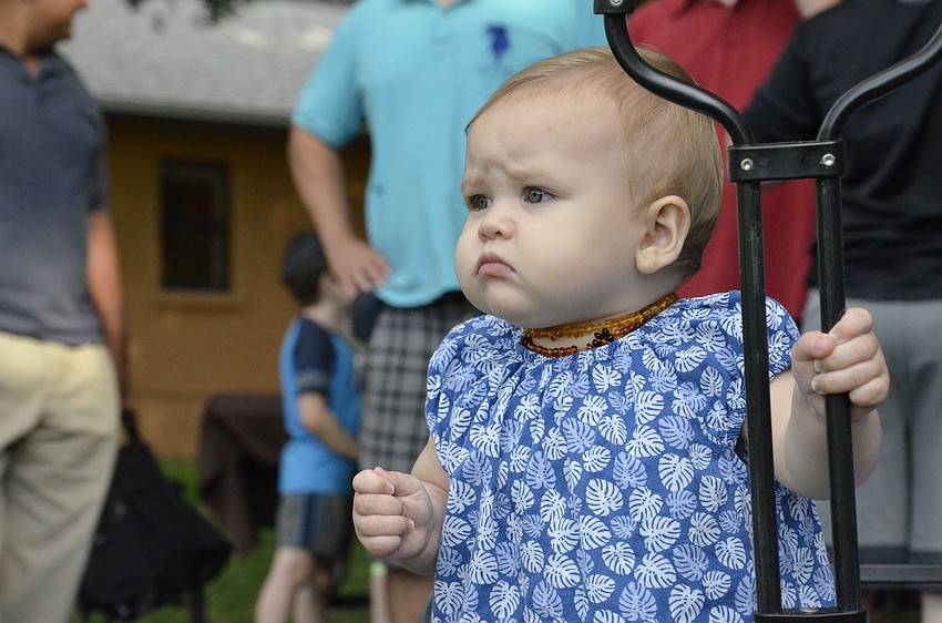 Ashira Tyrrell watches the fire show very seriously.