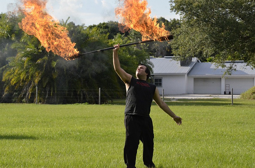 Richard Dean, part of Trick Fire of Sarasota shows off his skills.