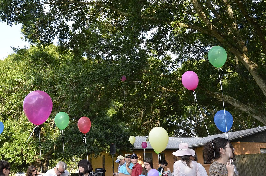 Children touted balloons during the celebration.