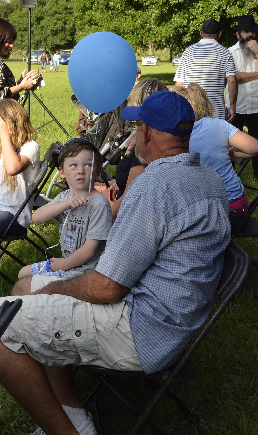Aidan Farren talks with his grandfather Gene Ames.