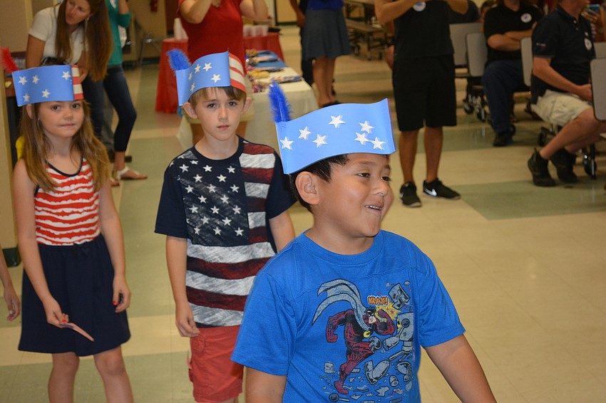 Ryan Wingate, Avery Hackman and Pablo Casaux Montiel walk to the stage for the concert.