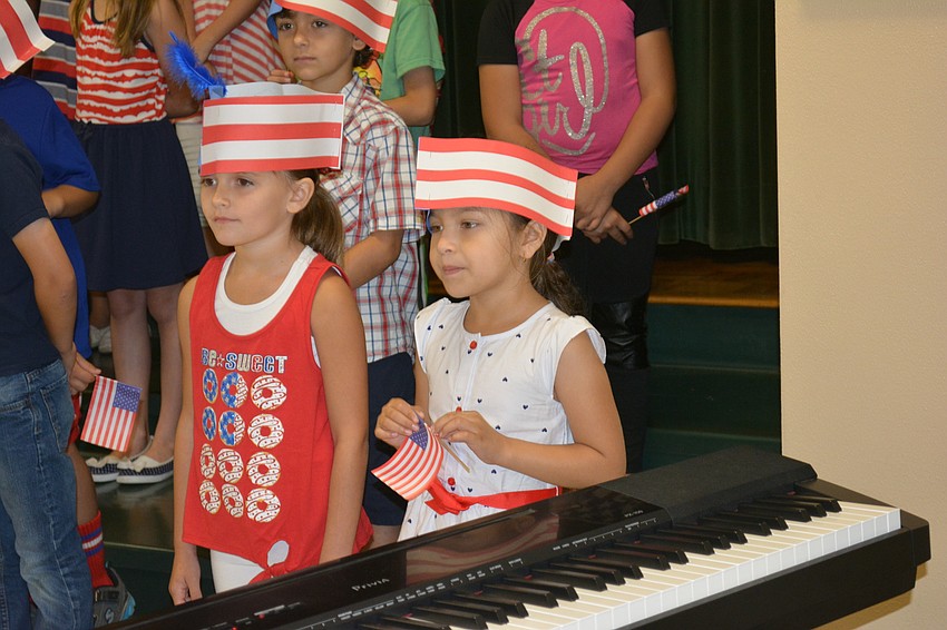 Karinzah Williams and Victoria Lozano Cabrales get ready for the program's opening song.