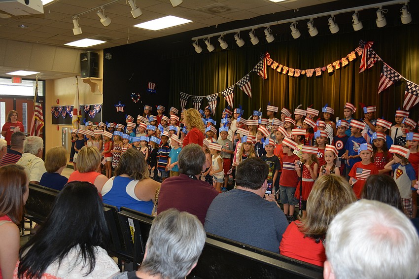 Parents packed the room to watch the first-graders perform seven patriotic songs.