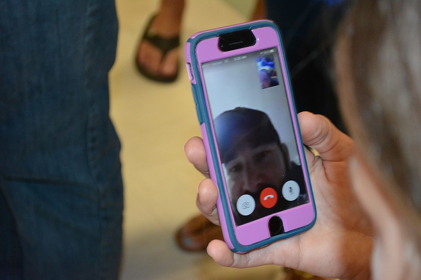 Sgt. Joe Baker, deployed in the Middle East, was able to watch his daughter, Witt first-grader Ryleigh Baker, perform in the concert.