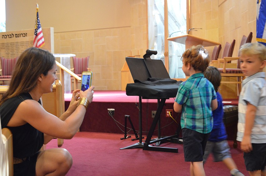 Jillian Walker snaps a shot of Daniel Fine.