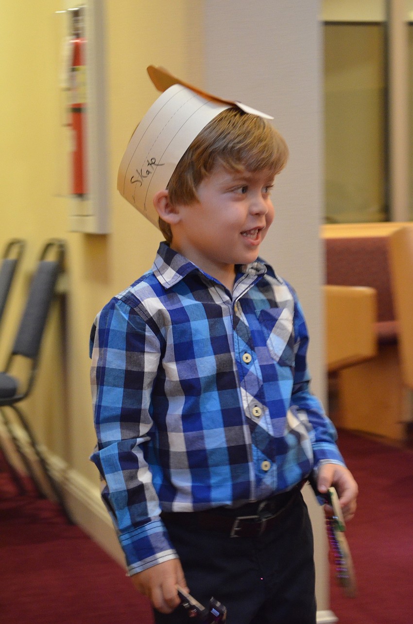 Skate Segal looks for his parents as he enter in the procession of students.