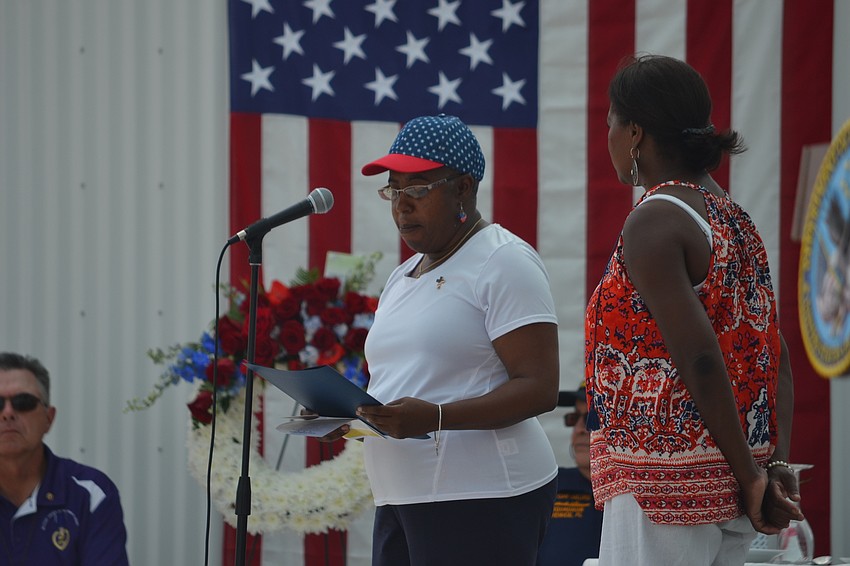 Sarasota County Commissioner Carolyn Mason reads an official proclamation recognizing the 150th anniversary of Memorial Day.
