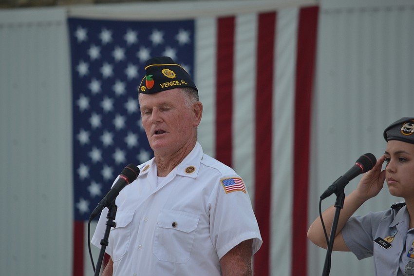 Kevin Kenney of the America Legion Post 159 performs the national anthem.