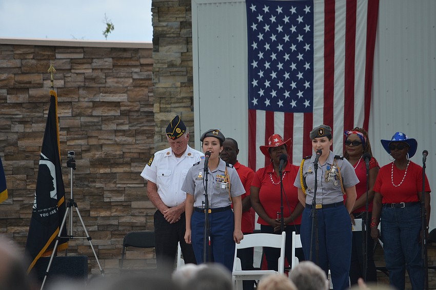 Sarasota Military Academy cadets Lauren Medreda and Allyson Scott perform 