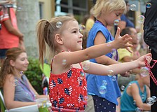 Lakewood Ranch's Lexi Sapanero, 4, had a wonderful time catching beads and bubbles.