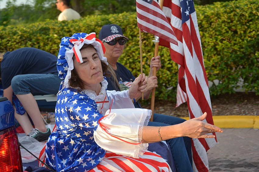 Kids watching the parade could catch candy thrown by Betsy Ross, played by Regina Mateus.
