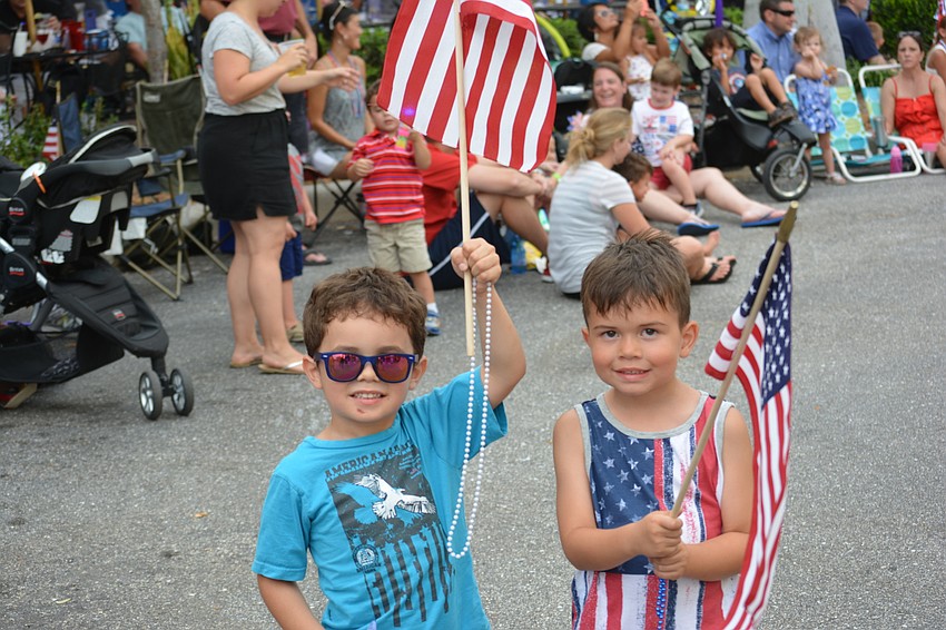 Esteban Morales, 4, of Sarasota, and Tyler Padgett, 5, of Parrish, can't wait for the parade to start.