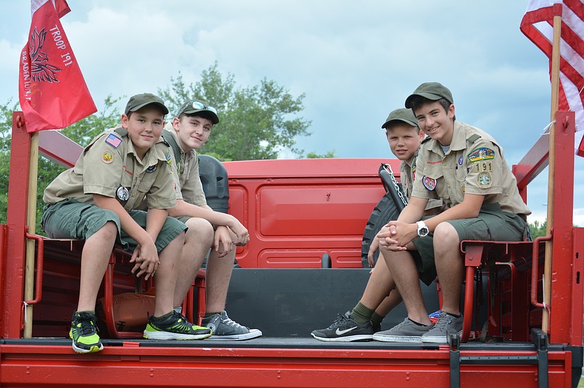 Troop 191 of Living Lord Lutheran of Lakewood Ranch was represented in the parade by Aiden O'Kelly, David Richardson, Luke Stoker and Michael Mansur, who rode the back of a West Manatee Fire Rescue truck.