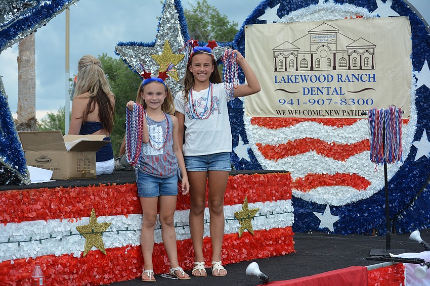 Lily Gillett, 8, and Madelyn Gillett, 10, rode the Lakewood Ranch Dental float.