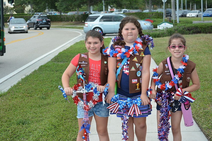Bella Talerico, Layla Robertson and Isabella Oliveira, all of Girl Scout Troop 888 of Tara Elementary, competed in the parade's decorate a scooter competition.