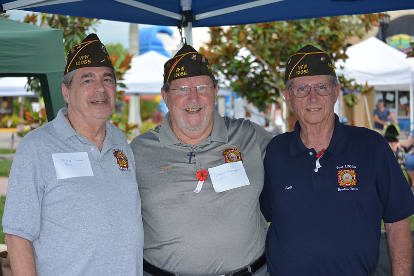 VFW Post 12055's Ernie Freedman, Navy, David Harrington, Army, and Ron Leonard, Marines, worked a booth at the parade.