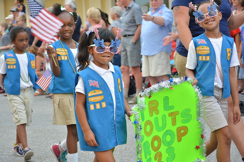 Girl Scouts Troop 523 shows up at the Tribute to Heroes Parade sporting some stylish sunglasses.