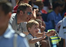 Eric and Covan Stasen wave to Sarasota Military Academy Prep cadets during the Downtown Sarasota Memorial Day Parade.