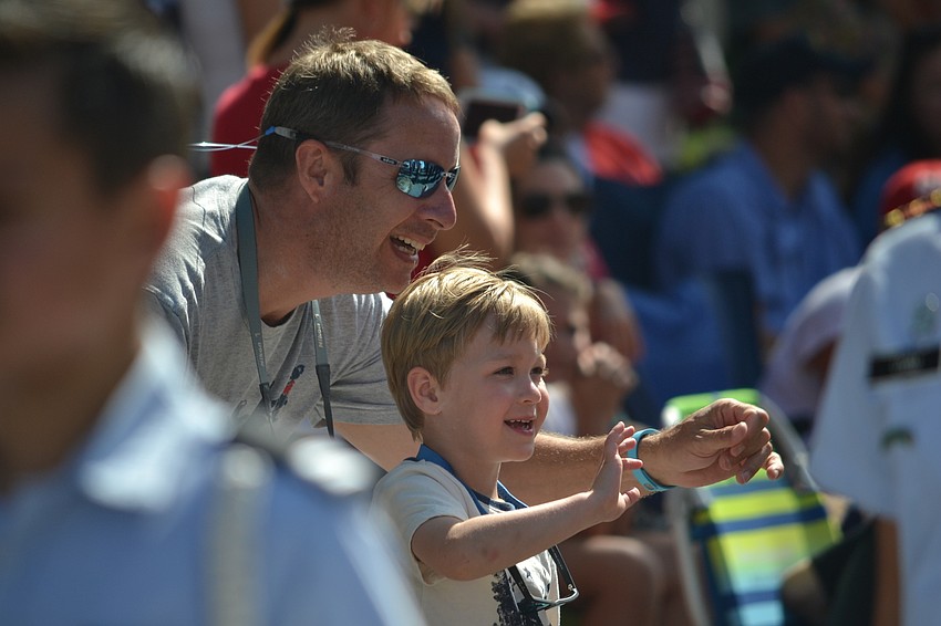 Eric and Covan Stasen wave to Sarasota Military Academy Prep cadets during the Downtown Sarasota Memorial Day Parade.