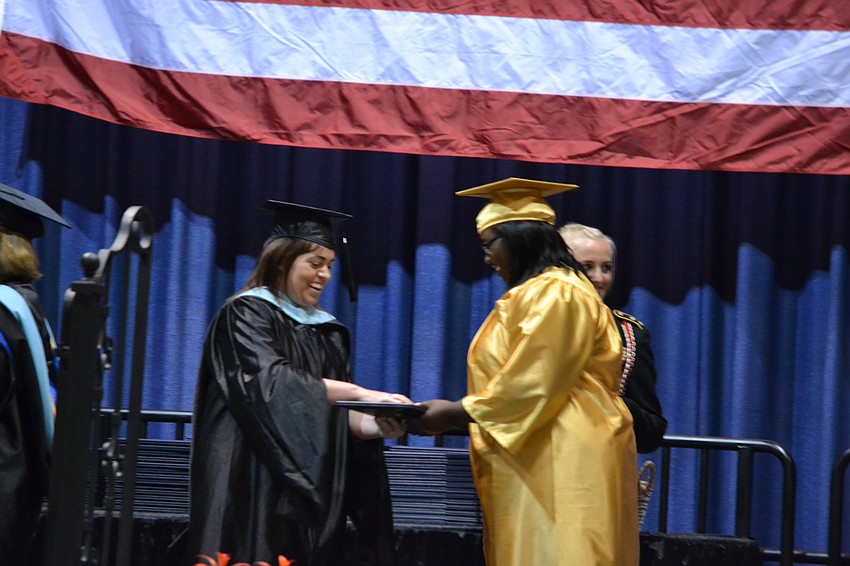Kadesha Johnson receives her diploma.