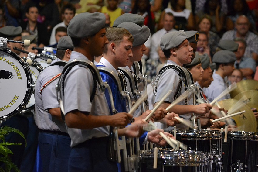 The Mighty SMA Drum Line performs for graduates.